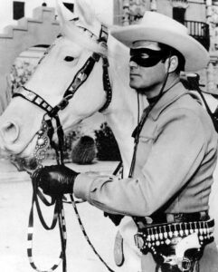 Clayton Moore as The Lone Ranger, with Silver